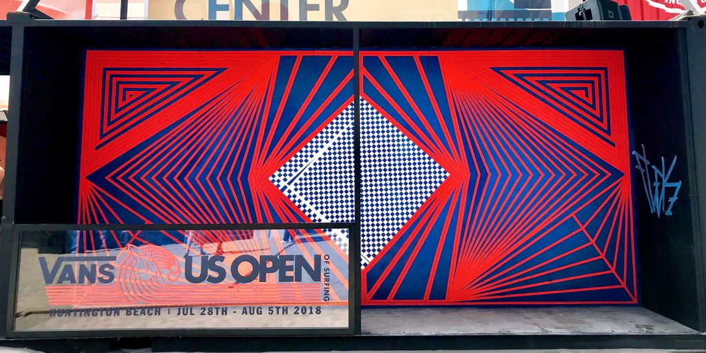 Flekz created tape art murals for the US Open. The mural uses red, blue, and checkerboard patterns.