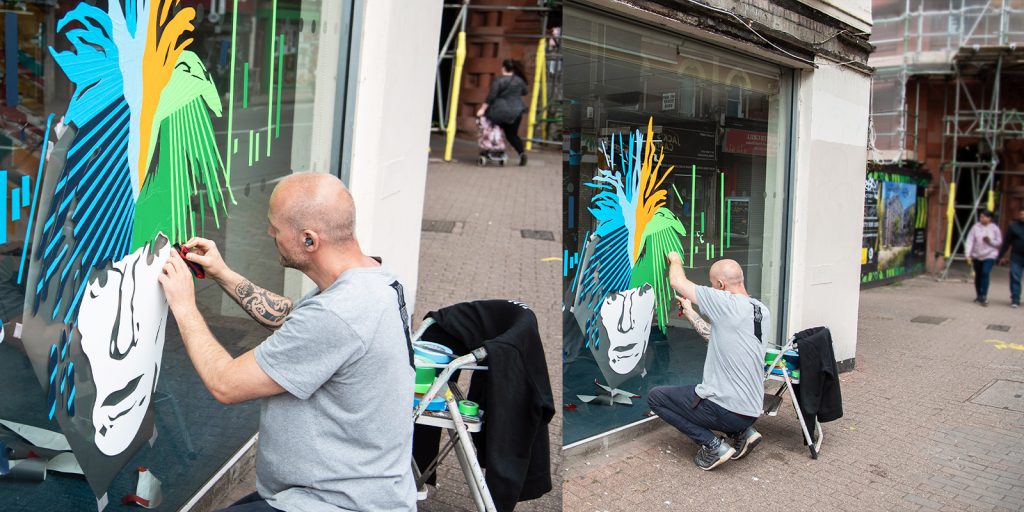 Rob working on his portrait of Andy Warhol for UpFest 2022